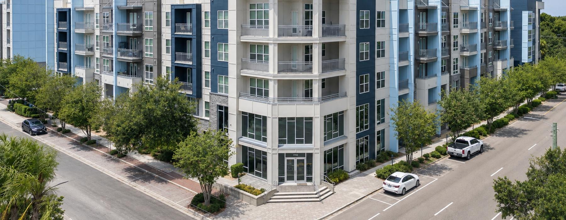 a building with cars parked in front