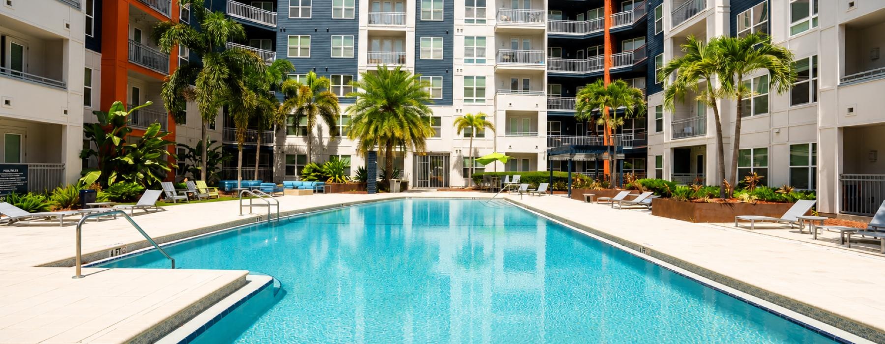Resort-style swimming pool with lounge seating